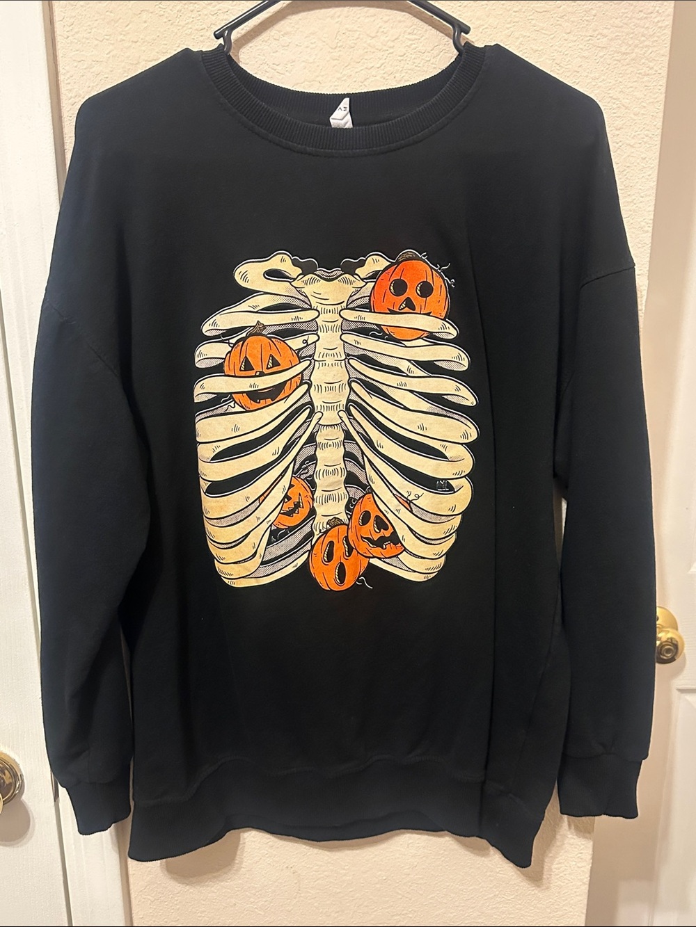 Black Halloween Ribcage Sweatshirt with Pumpkin Art